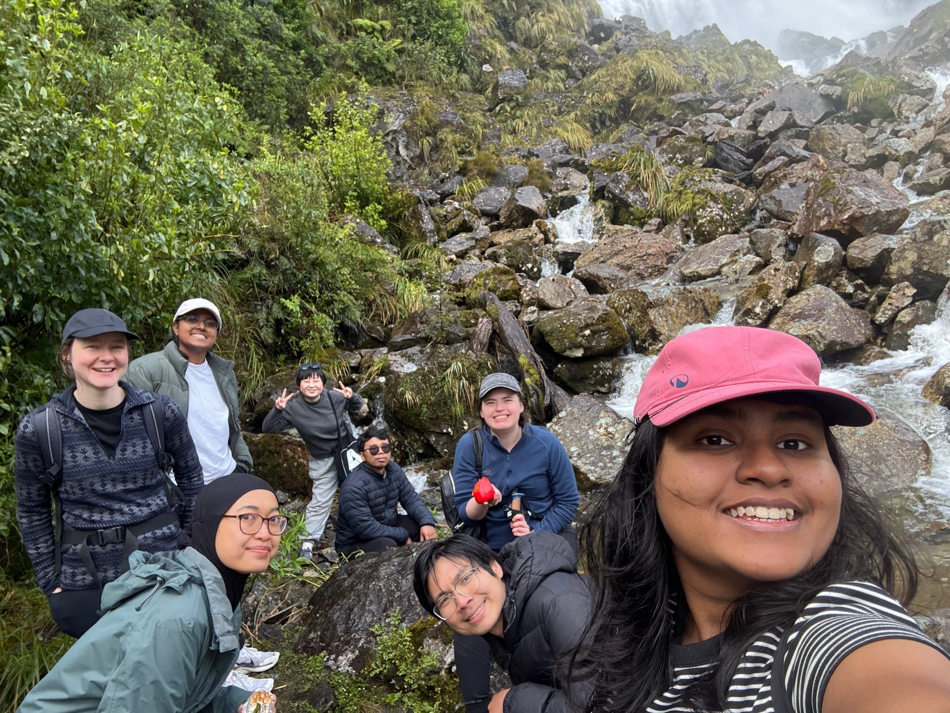 Group photo beneath the waterfall